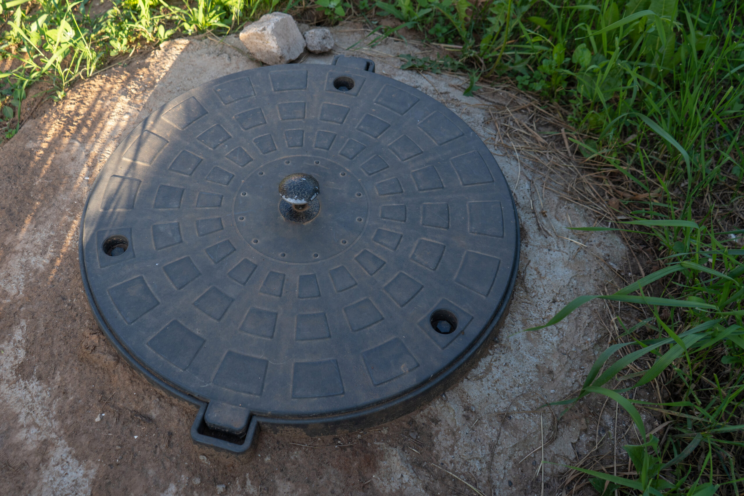 Black plastic septic tank manhole